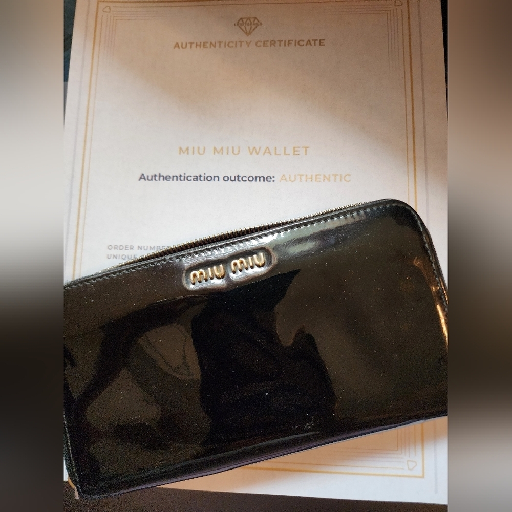 Preowned Miu Miu black patent leather wallet with COA